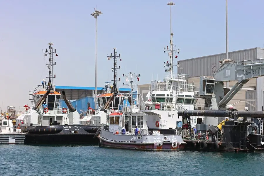 A general view shows tug boats of Mwani Qatar, ports management company, at Hamad Port in the Qatari capital Doha on March 20, 2022. (Photo by KARIM JAAFAR / AFP).