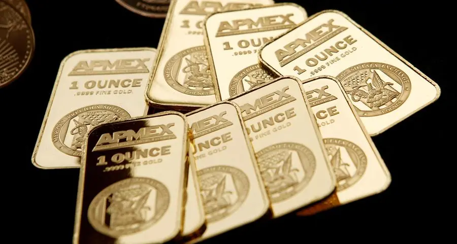 Gold hovers near 1-month low ahead of US data, Fed speakers