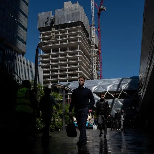 UK jobs market downturn eases as pay pressure pick up, survey shows