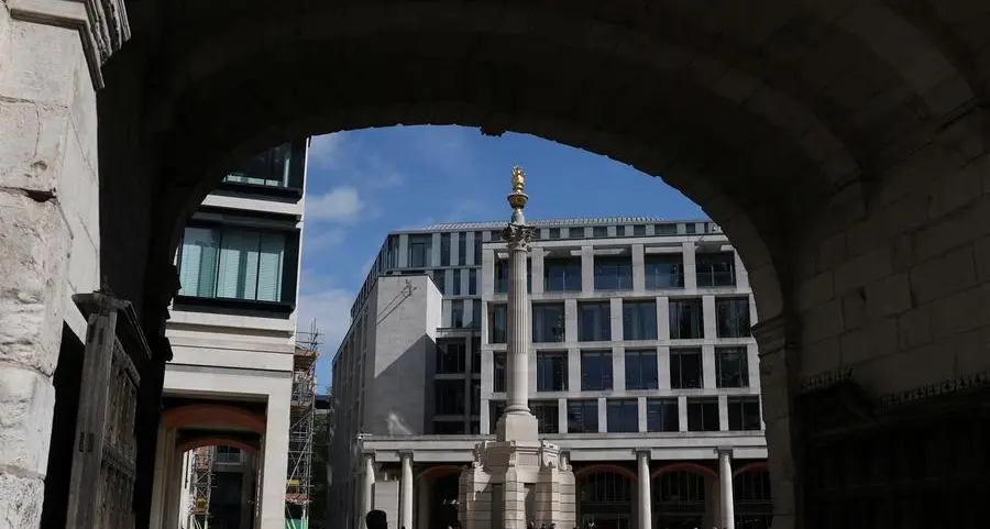 London stocks edge lower as sterling climbs, automakers slip