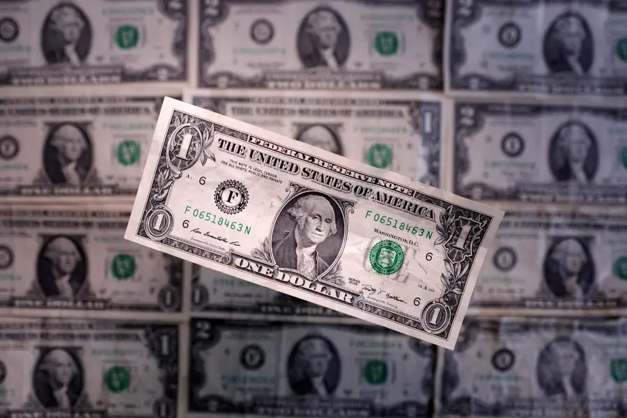 Dollar edges lower after US credit downgrade, Aussie pares losses before RBA