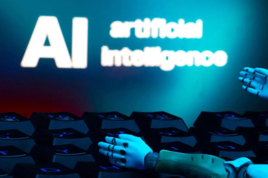 FILE PHOTO: A message reading \"AI artificial intelligence,\" a keyboard and robot hands are seen in this illustration created on January 27, 2025. REUTERS/Dado Ruvic/Illustration. , Reuters