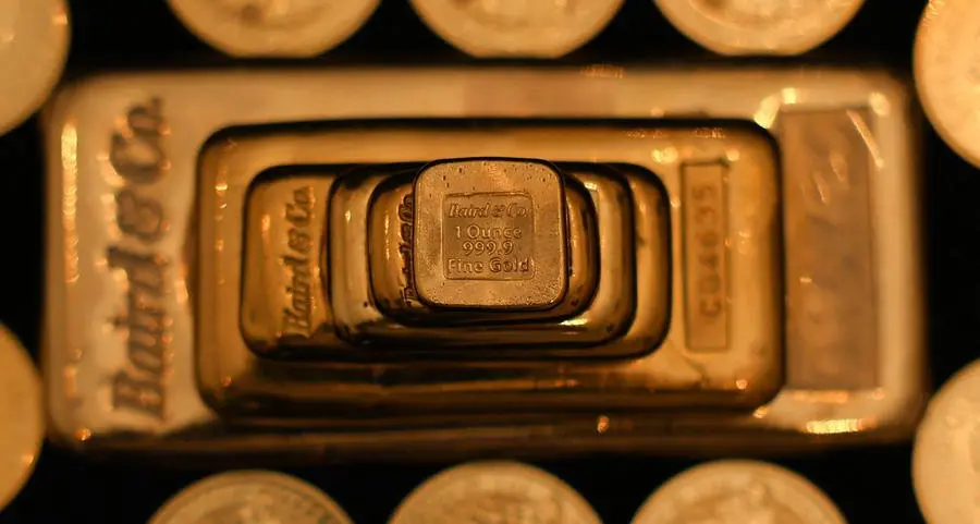 Gold's record run pauses as investors book profits