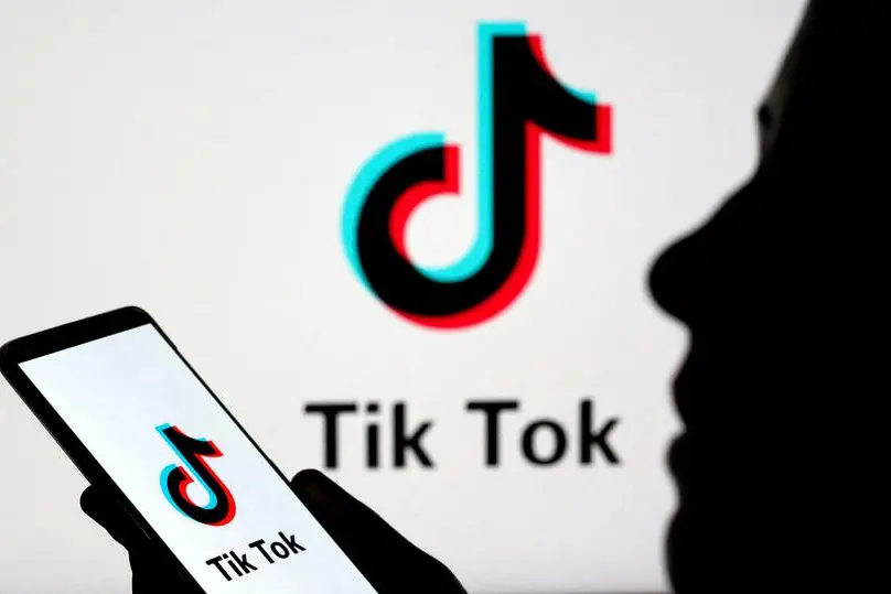 FILE PHOTO: A person holds a smartphone with Tik Tok logo displayed in this picture illustration taken November 7, 2019. Picture taken November 7, 2019. REUTERS/Dado Ruvic/Illustration. , Reuters
