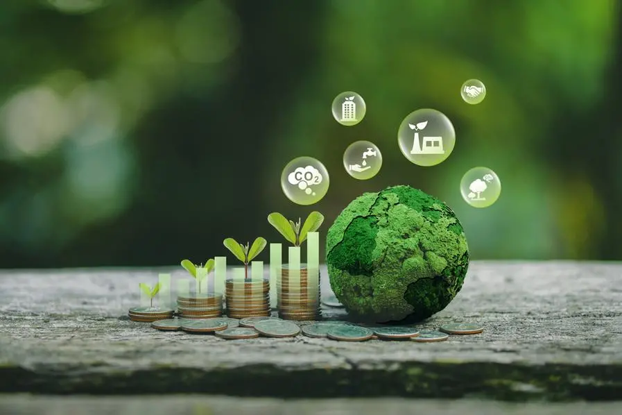 Green business growth. Sustainable investment finance, ESG funds or sustainability funds. A tree grows on a pile of coins with a graph and a green globe with icons. Image used for illustrative purpose. Getty Images , Getty Images