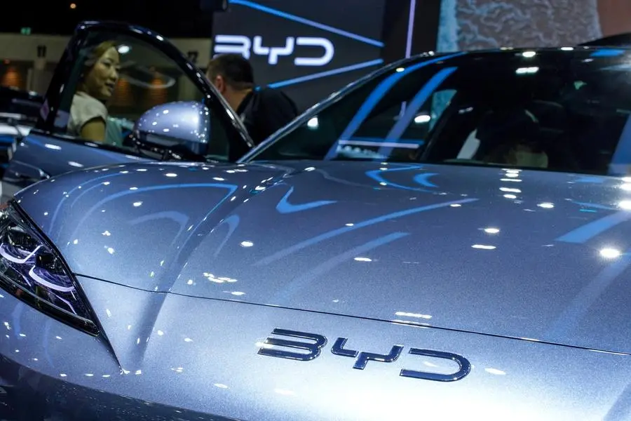 FILE PHOTO: A visitor stands next to a BYD Sealion 7 EV car at the 41st Thailand International Motor Expo, in Bangkok, Thailand, November 29, 2024. REUTERS/Athit Perawongmetha. , Reuters