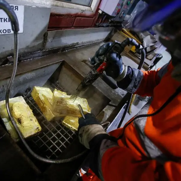 Gold regains some ground as dollar eases, trade optimism fades