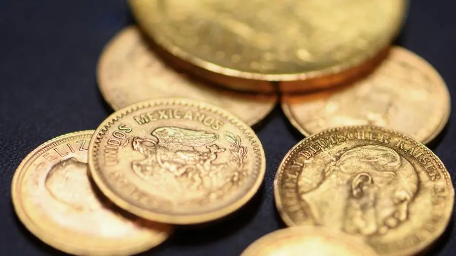 Gold lingers near 7-month low as Fed hike bets boost dollar