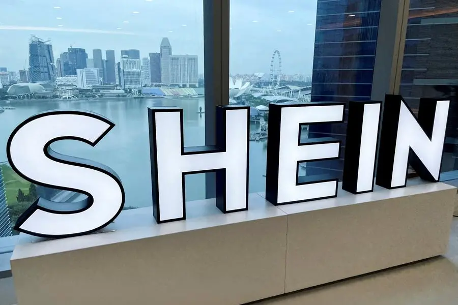 FILE PHOTO: A Shein logo is pictured at the company\\'s office in the central business district of Singapore, October 18, 2022. REUTERS/Chen Lin. , Reuters