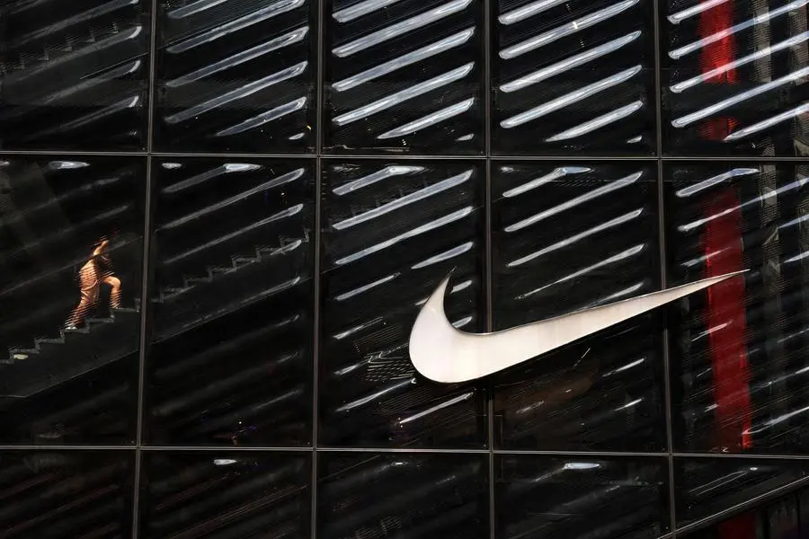 FILE PHOTO: A woman walks inside the Nike House of Innovation NYC on 5th Avenue in New York City, U.S., June 17, 2024. REUTERS/Shannon Stapleton. , Reuters