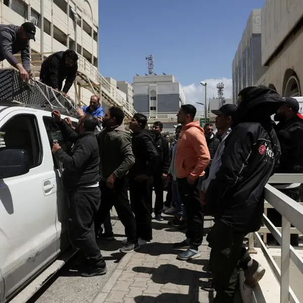 At Beirut hospital, grieving families identify mangled bodies after Israeli strikes