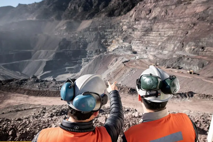FILE PHOTO: Two men stand at Anglo American\\'s El Soldado copper mine in Chile, obtained by Reuters on April 26, 2024. Anglo American/Handout via REUTERS.