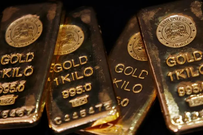 FILE PHOTO: Gold bars are displayed to be photographed at bullion house in Mumbai December 3, 2009. Gold struck another peak of new high of $1,224.65 an ounce on Thursday because of its investor appeal as a safe asset and Asian stocks looked past Wall Street\\'s weak finish to eke out gains. REUTERS/Arko Datta. , Reuters