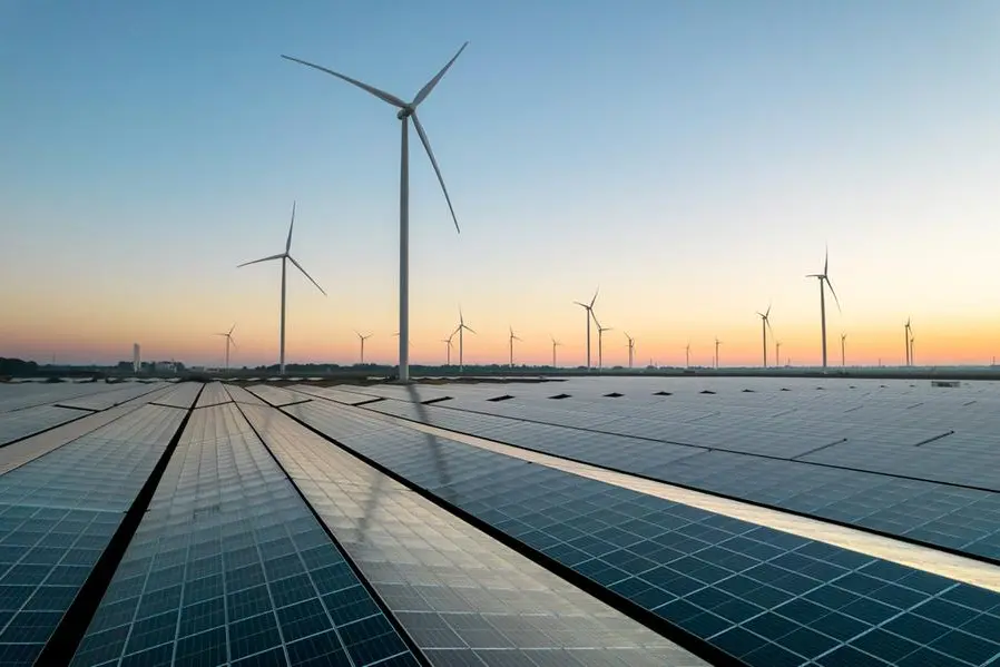 Image used for illustrative purpose. Reflected sky on a solar panel field during a summer sunrise. Wind turbines can be seen on the horizon. Muntendam, the Netherlands, September 2023. Getty Images , Getty Images
