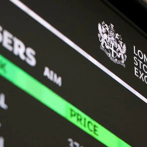 UK's FTSE 100 hovers near 10,000 mark as Venezuela strikes lift defence, mining stocks