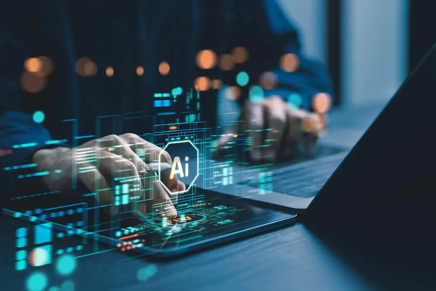 Humans are using laptops and computers to interact with AI, helping them create, code, train AI, or analyze big data with fast, cutting-edge technology. Image used for illustrative purpose. Image courtesy: Getty Images/ Wanan Yossingkum , Getty Images
