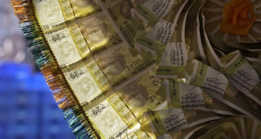 By Jaspreet Kalra slips to record low, but central bank likely curbs losses