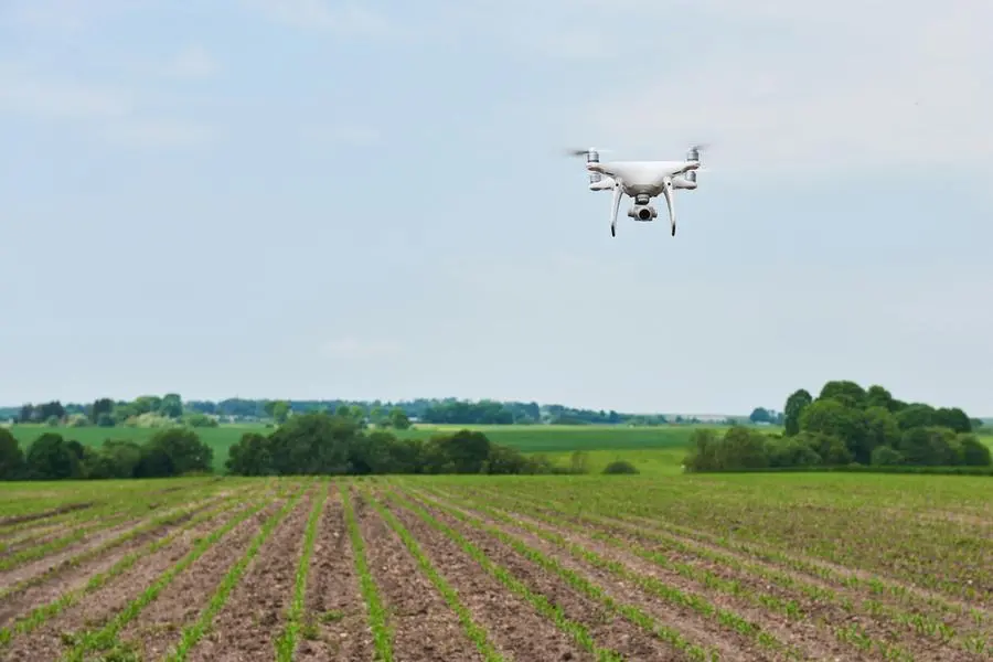 Drone quad copter with high resolution digital camera on green corn field. Image courtesy: Xylem Vue