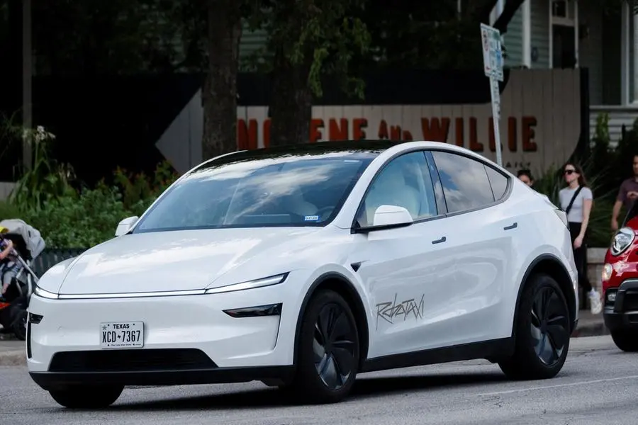 FILE PHOTO: A Tesla robotaxi drives on the street along South Congress Avenue in Austin, Texas, U.S., June 22, 2025. REUTERS/Joel Angel Juarez/File Photo , Reuters/REUTERS