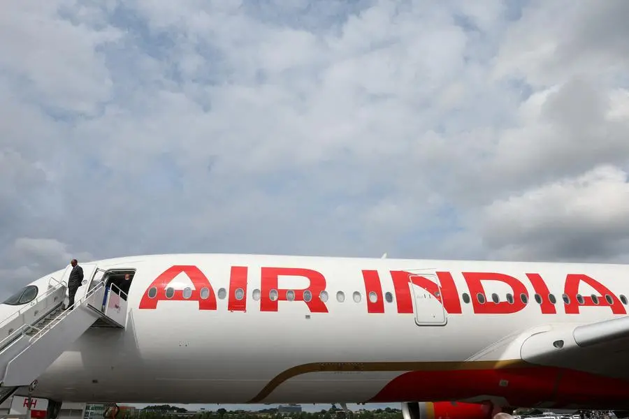 FILE PHOTO: Branding for Air India is seen on an Airbus A350-900 at the Farnborough International Airshow, in Farnborough, Britain, July 24, 2024. REUTERS/Toby Melville. , Reuters