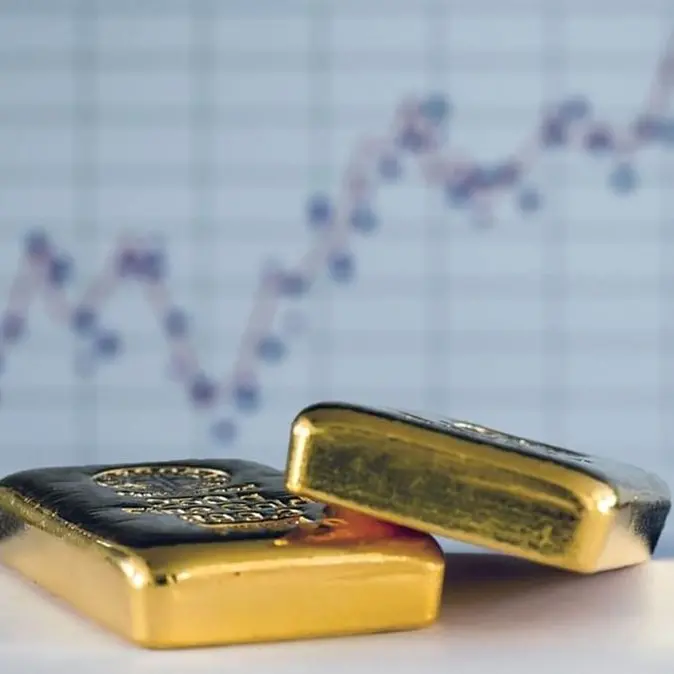 Gold gains as dollar slips, investors await US-China trade talks