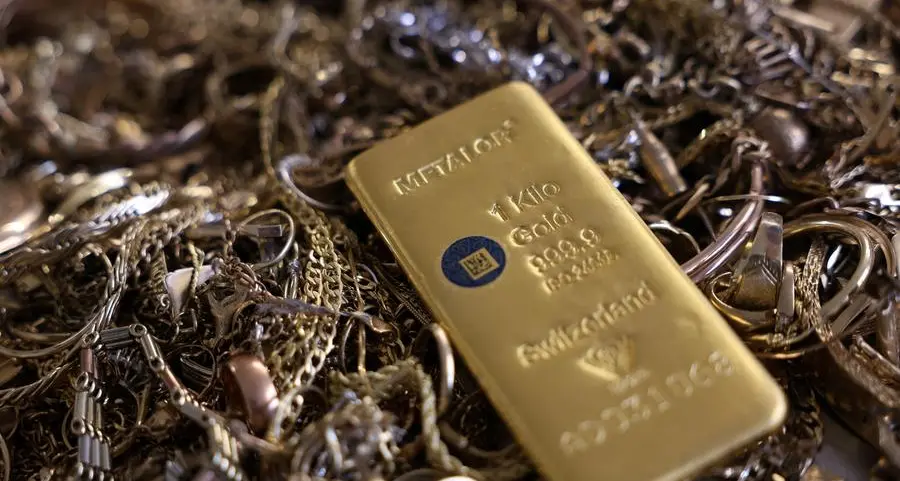 Gold eases as firmer dollar, hawkish Fed weigh on prices