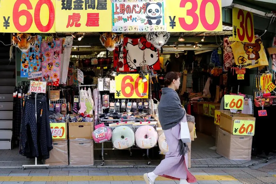 FILE PHOTO: A woman in kimono, walks past a shop in a shopping district in Tokyo, Japan, November 29, 2016. REUTERS/Toru Hanai. , Reuters