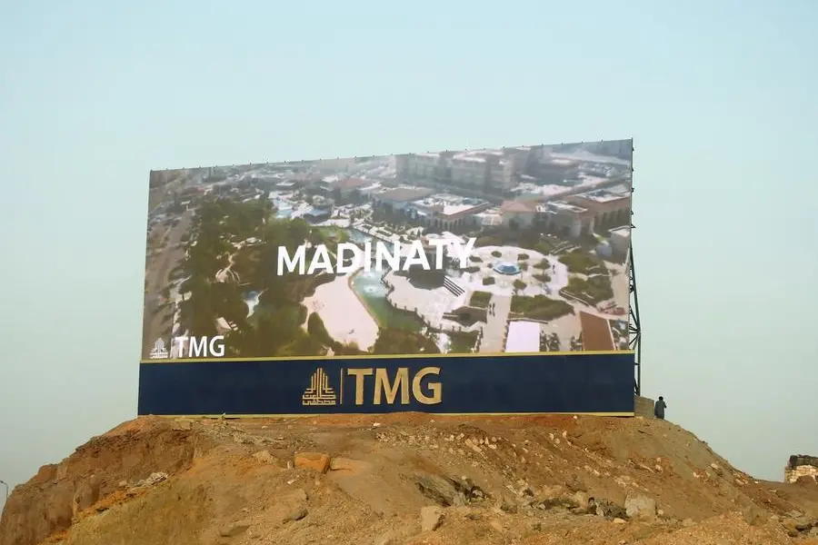 Cairo, Egypt, September 24 2022: A large Advertisement LCD LED TV on a sand hill for TMG Talaat Moustafa Group, one of the largest conglomerates in Egypt, Madinaty and Al Rehab city in New Cairo, selective focus. Image used for illustrative purpose. Getty Images , Getty Images