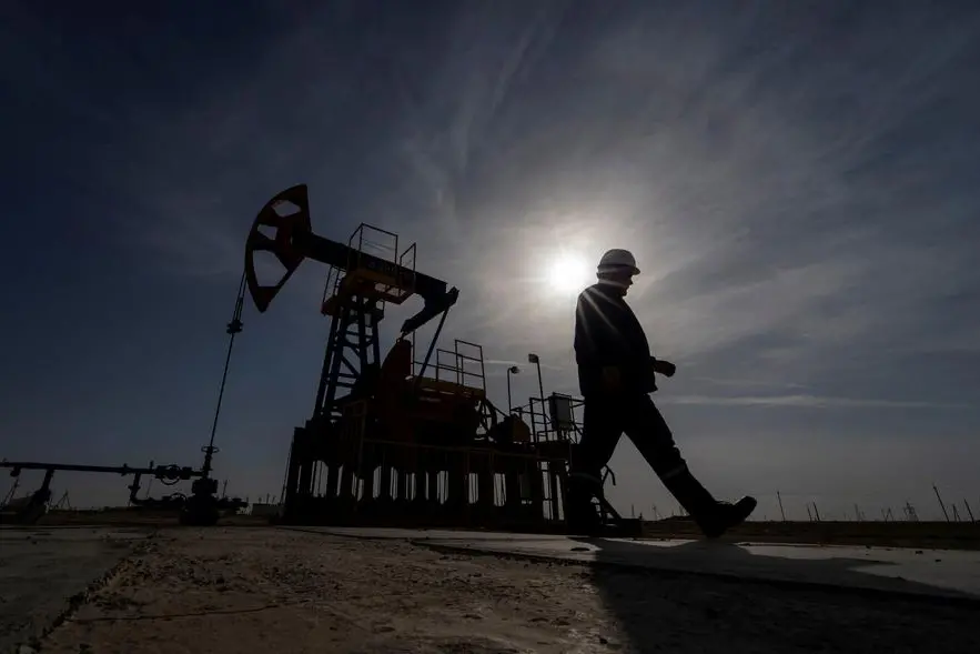 FILE PHOTO: An oil and gas industry worker walks during operations of a drilling rig at Zhetybay field in the Mangystau region, Kazakhstan, November 13, 2023. REUTERS/Turar Kazangapov. , Reuters