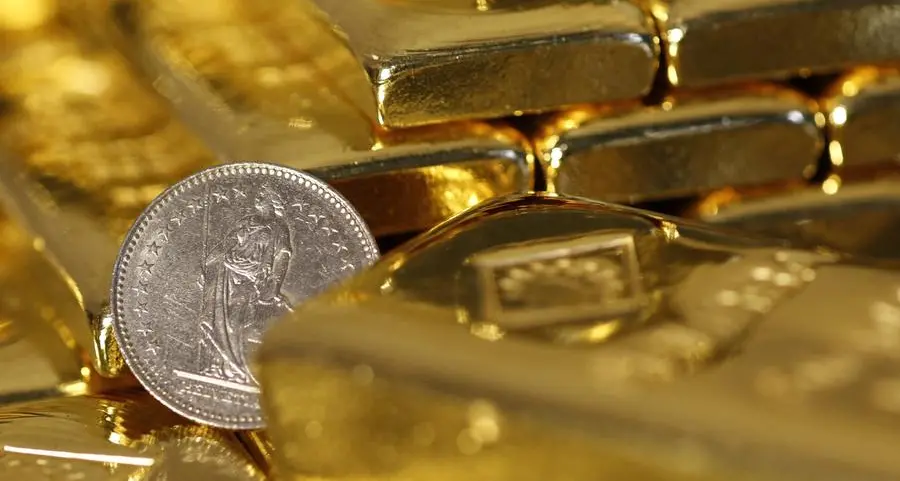 Gold edges down as investors turn cautious ahead of year-end US data