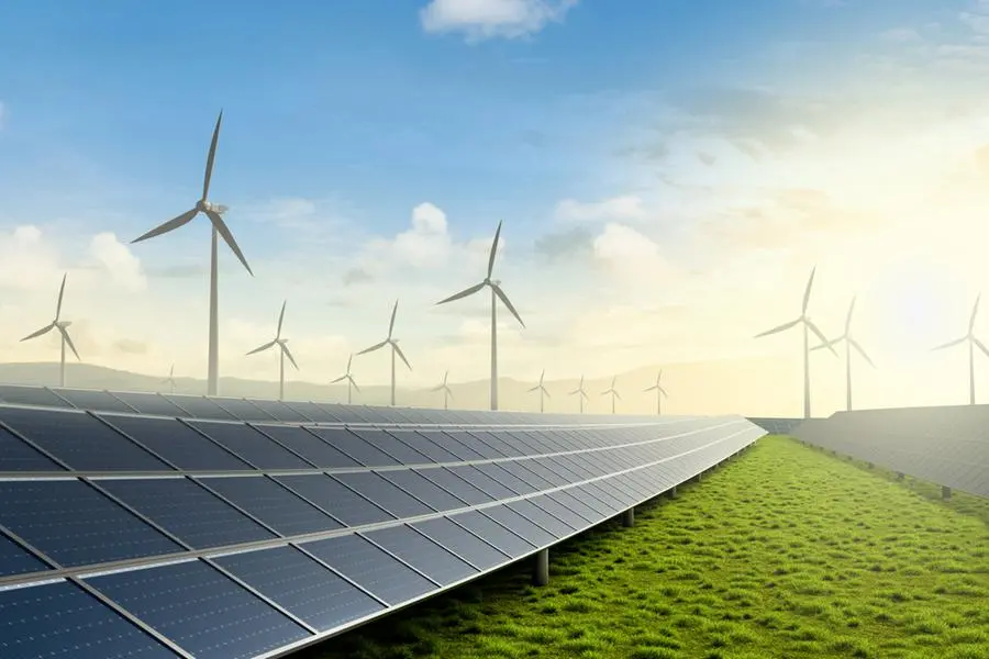 Solar farm and wind turbine on green fields with beautiful sunset. Image used for illustrative purpose. Getty Images , Getty Images