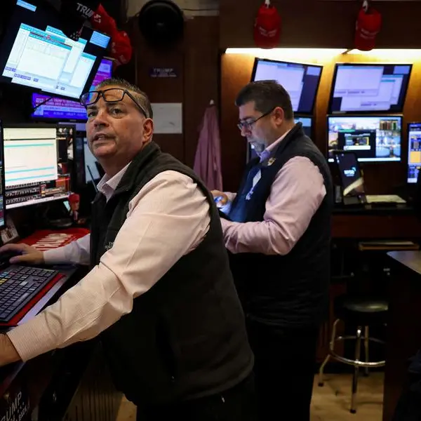 Japanese stocks jump, dollar firms on trade hopes; bitcoin soars
