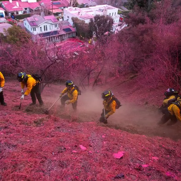 Los Angeles races to contain wildfires before severe winds return