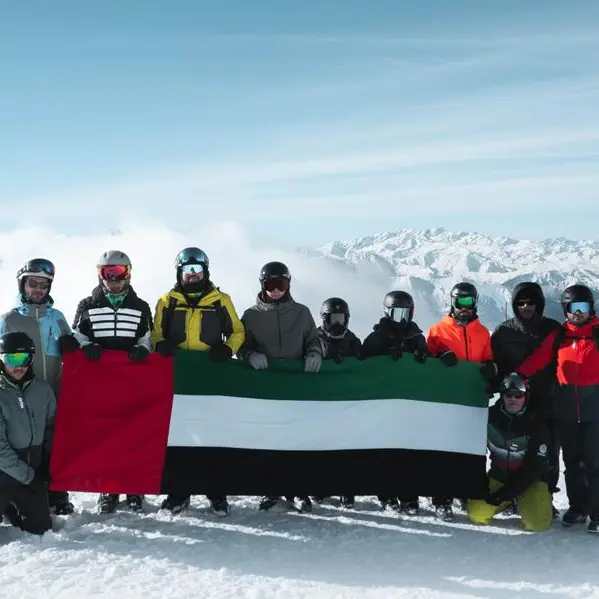 UAE flag, portrait of Zayed and Rashid unfurled atop Alps as part of Eid Al Etihad celebrations