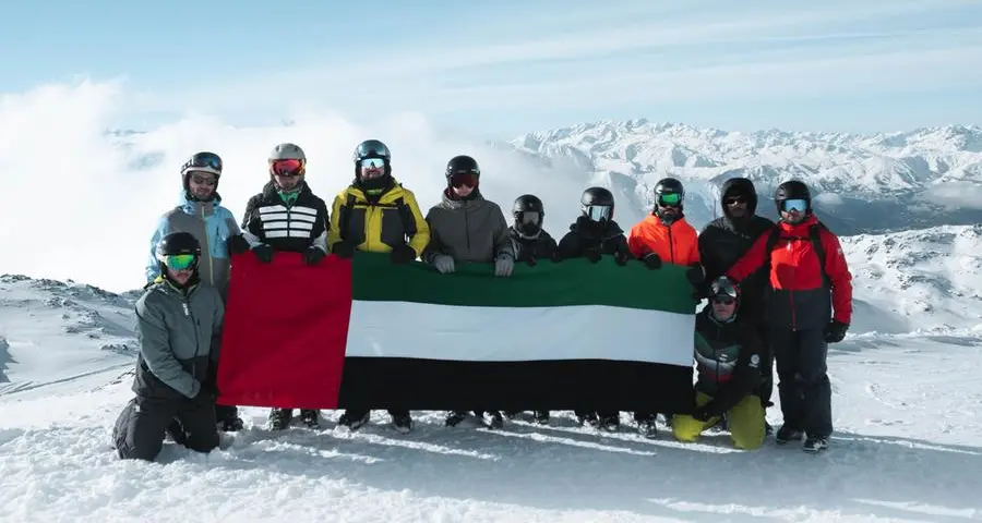 UAE flag, portrait of Zayed and Rashid unfurled atop Alps as part of Eid Al Etihad celebrations