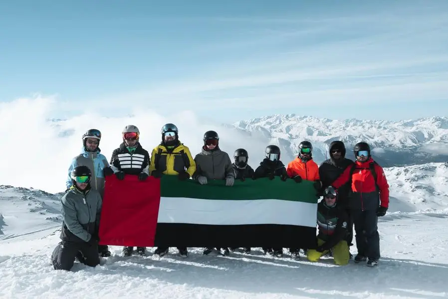 UAE flag, portrait of Zayed and Rashid unfurled atop Alps as part of Eid Al Etihad celebrations
