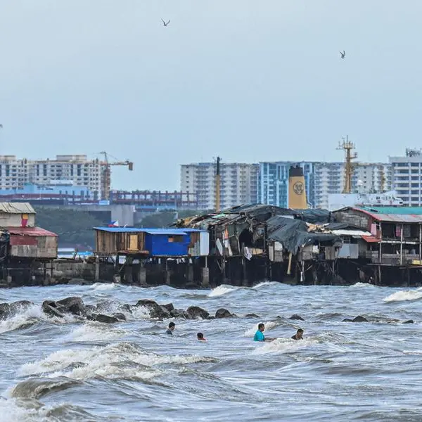 Thousands flee homes as fierce tropical storm batters Philippines