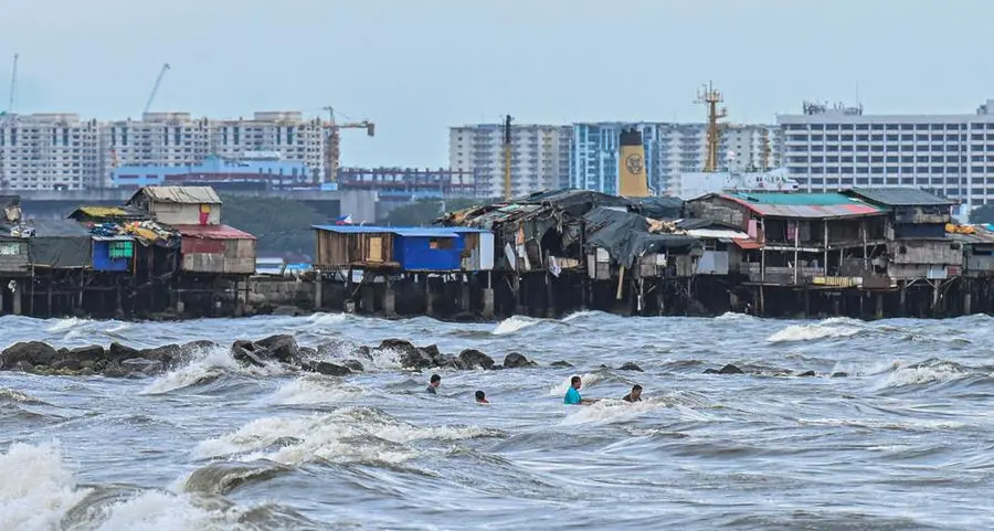 Thousands flee homes as fierce tropical storm batters Philippines