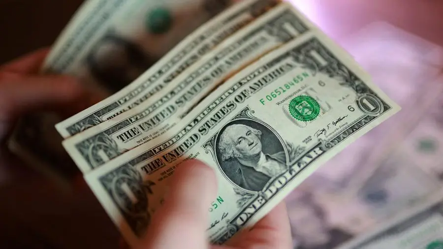 Dollar cashes in on safe-haven demand, set for best month since July