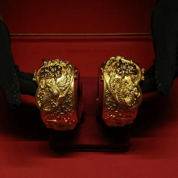 Gold climbs as lower oil eases inflation, rate-hike fears