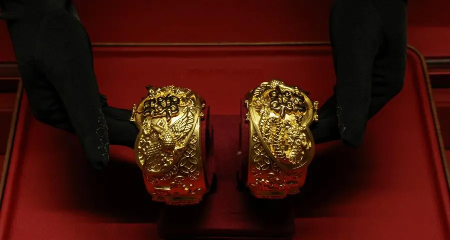 Gold climbs as lower oil eases inflation, rate-hike fears