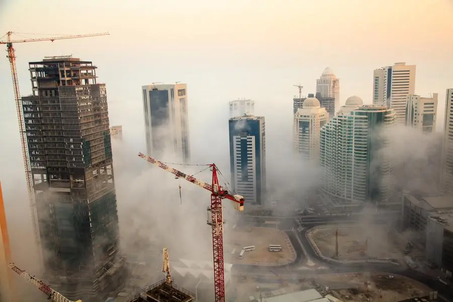 Clouds enveloping construction site against luxury residences and corporate skyscrapers in Doha. Image used for illustrative purpose. Getty Images , Getty Images