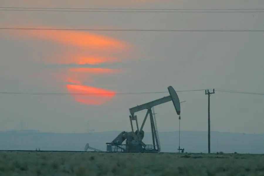 KUWAIT - JANUARY 15: The sun sets behind a oil derek January 15, 2003 near the Saudi Arabian border, Kuwait. Kuwait produces 10% of the worlds oil and has promised to increase production as needed in the event of a war in Iraq. (Photo by Joe Raedle/Getty Images). Image used for illustrative purpose. , Getty Images