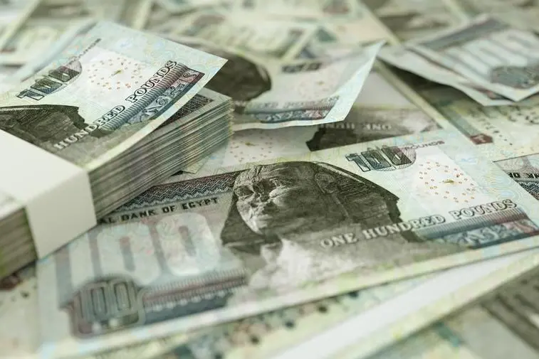 Close up of Egyptian pound notes spread on table. 3d rendering on money scattered on surface. Image used for illustrative purpose. Getty Images , Getty Images