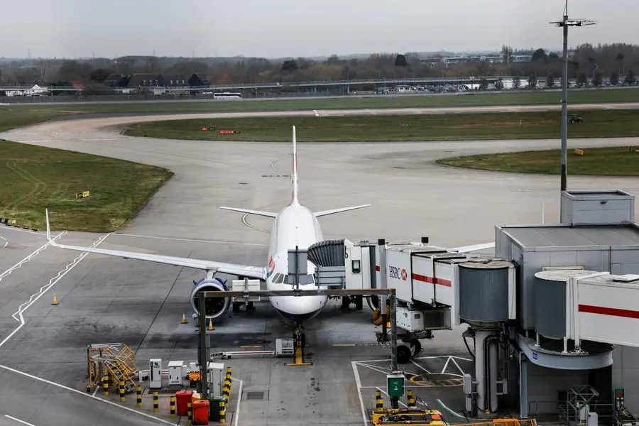 An airplane remains parked on the tarmac at Heathrow International Airport after a fire at a nearby electrical substation wiped out the power at the airport, near London, Britain, March 21, 2025. REUTERS/Carlos Jasso. , Reuters
