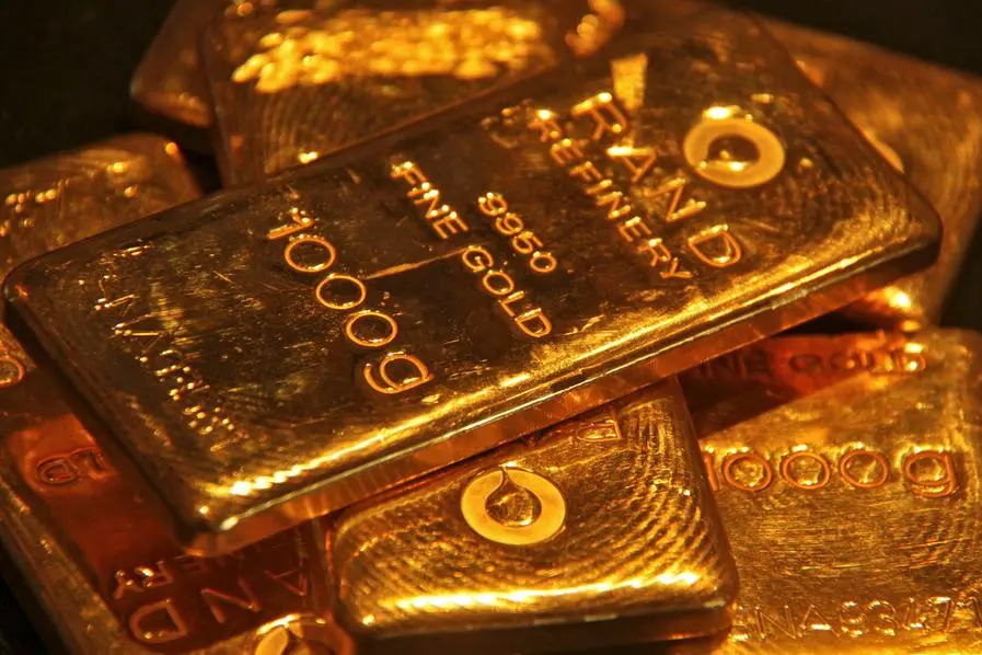 FILE PHOTO: Gold bars are displayed at a gold jewellery shop in the northern Indian city of Chandigarh May 8, 2012. Gold imports by India, the world\\'s biggest buyer of bullion, could rise on pent-up demand from jewellers after the federal government decided to scrap an excise duty on jewellery it imposed in March, the head of a trade body said on Monday. REUTERS/Ajay Verma. , Reuters