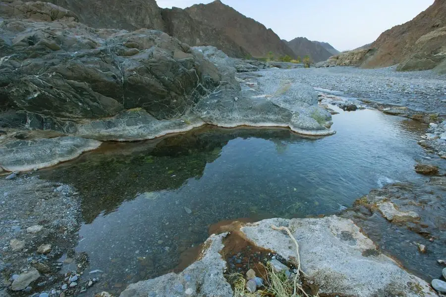Beautiful mountain lake inside the crater. Wadi Tanuf. Oman. Image used for illustrative purpose. Image courtesy: Getty Images/ Anna Skvortsova