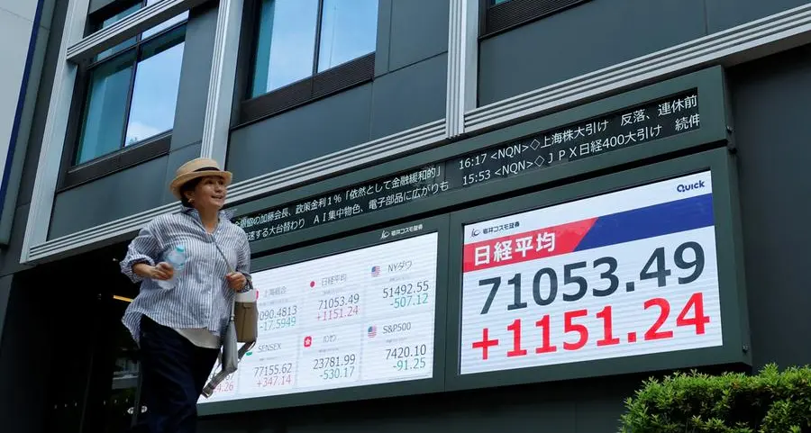 Stocks set records in Japan, South Korea; dollar gets Fed boost