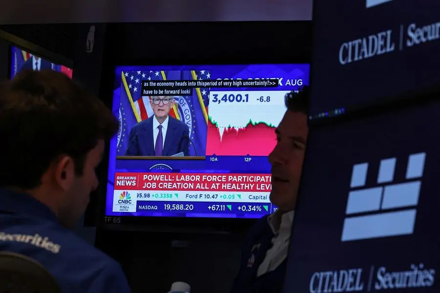 Traders work, as a screen broadcasts a news conference by U.S. Federal Reserve Chair Jerome Powell following the Fed rate announcement, on the floor of the New York Stock Exchange (NYSE) in New York City, U.S., June 18, 2025. REUTERS/Brendan McDermid , Reuters/REUTERS