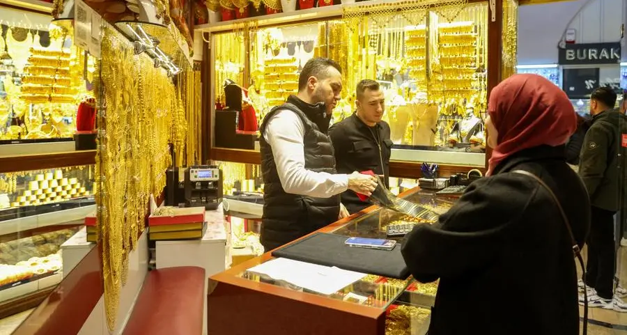 Gold climbs off more than one-month low; Middle East risks linger